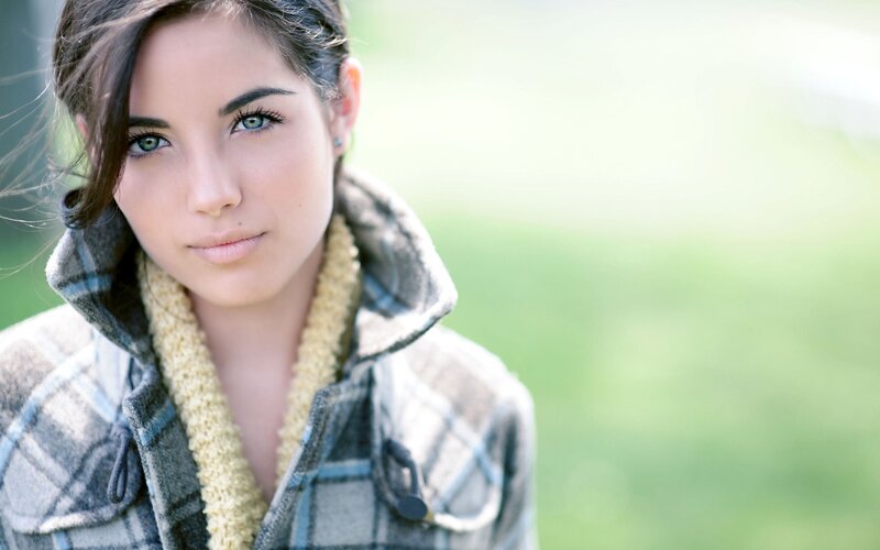 woman in plaid coat outdoors