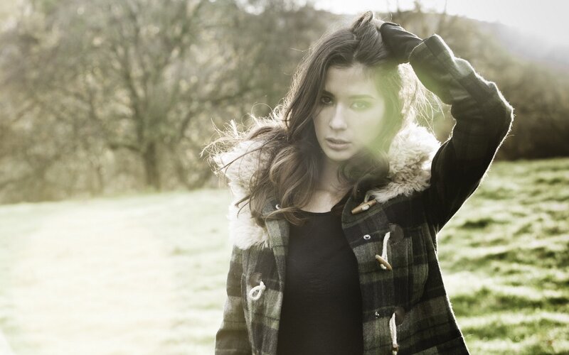 woman in plaid coat outdoors
