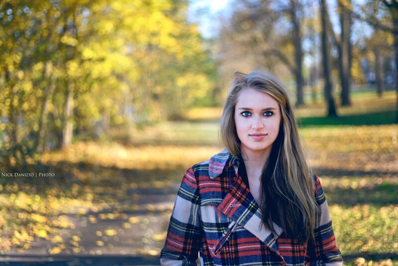 woman in plaid coat outdoors