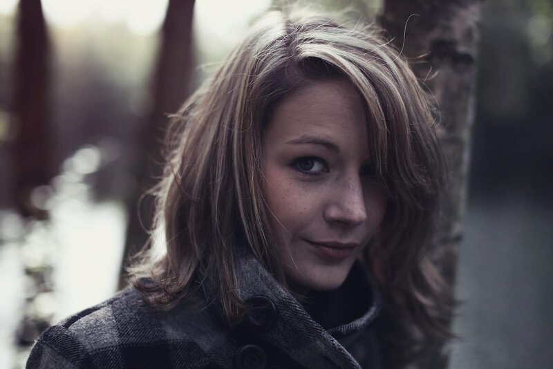 woman in plaid coat outdoors
