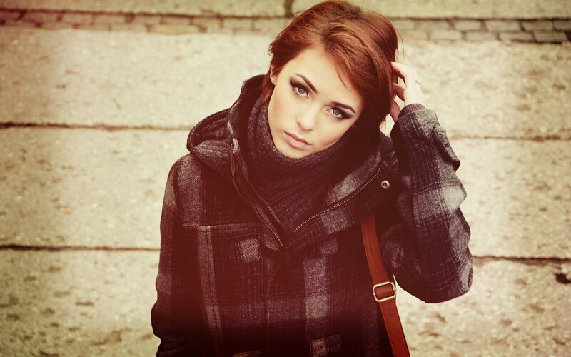 woman in plaid coat outdoors