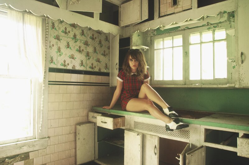woman in plaid dress on counter