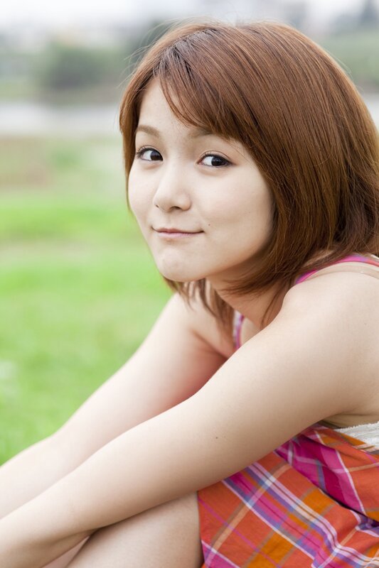 woman in plaid dress outdoors