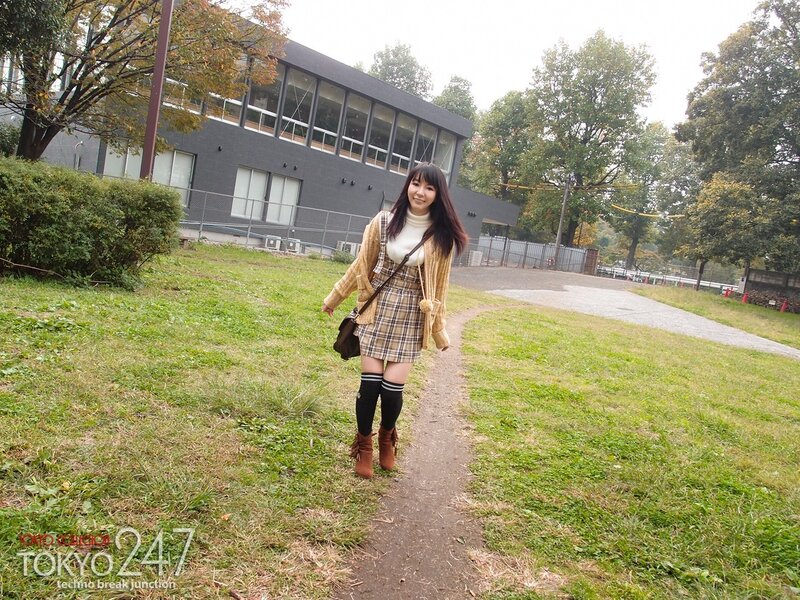 Woman in plaid dress outdoors