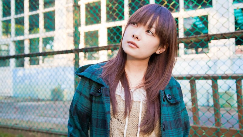 woman in plaid jacket outdoors