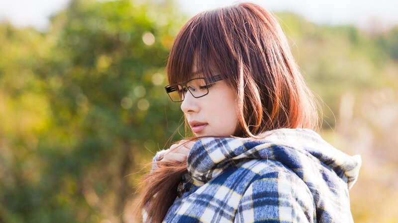 woman in plaid jacket outdoors