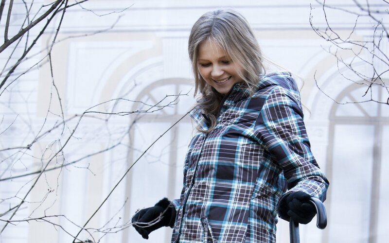 woman in plaid jacket outdoors