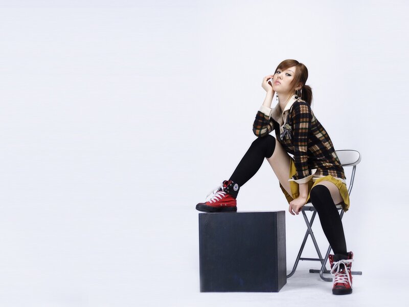woman in plaid jacket sitting