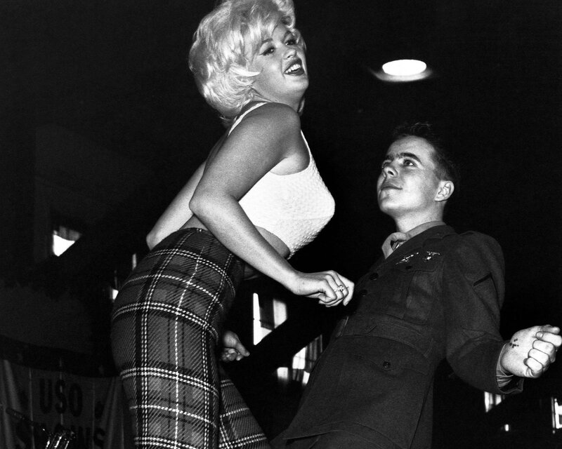 Woman in plaid pants dancing