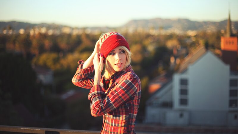 woman in plaid shirt and beanie