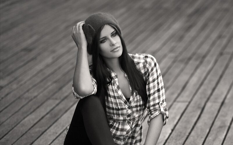 woman in plaid shirt and beanie