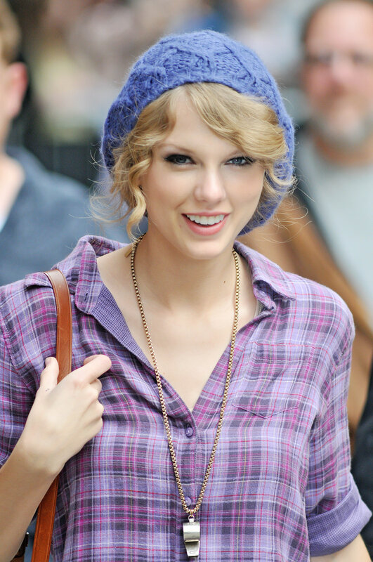 woman in plaid shirt and beanie