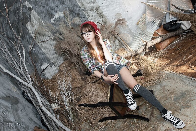woman in plaid shirt and glasses