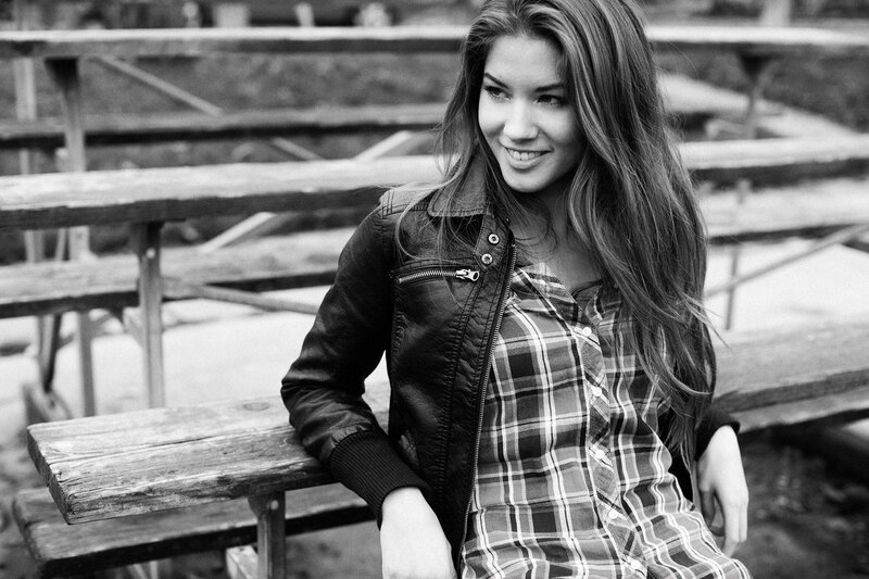 woman in plaid shirt and jacket