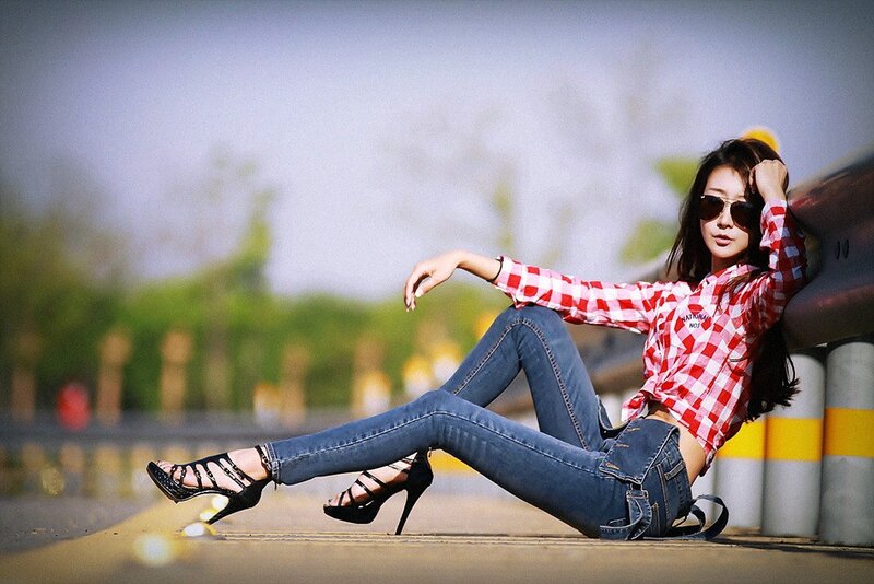 woman in plaid shirt and jeans