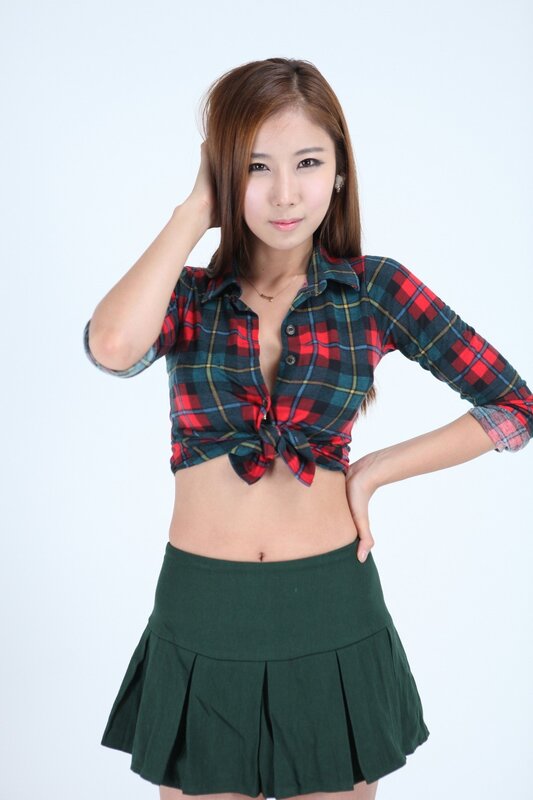 woman in plaid shirt and skirt