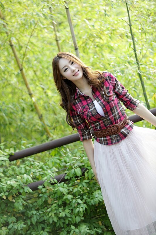 woman in plaid shirt and skirt