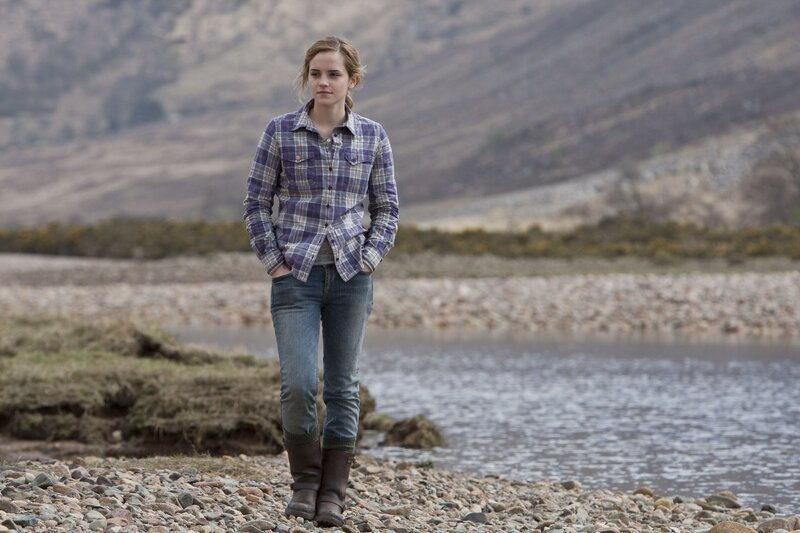 woman in plaid shirt by river