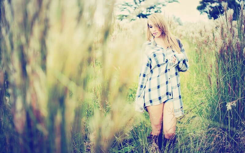 woman in plaid shirt field