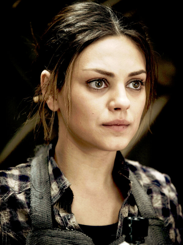 woman in plaid shirt looking concerned
