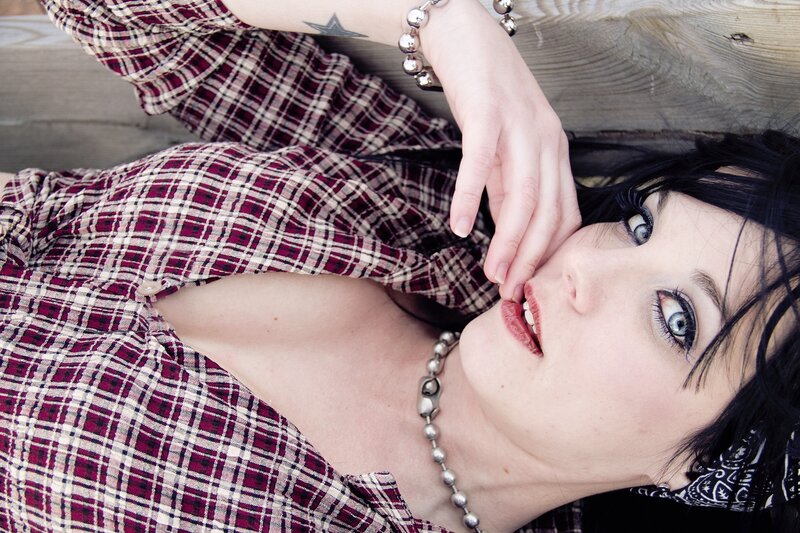 woman in plaid shirt lying down