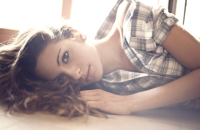 woman in plaid shirt lying down