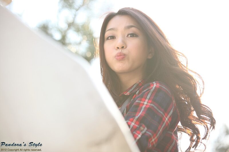 woman in plaid shirt making a face