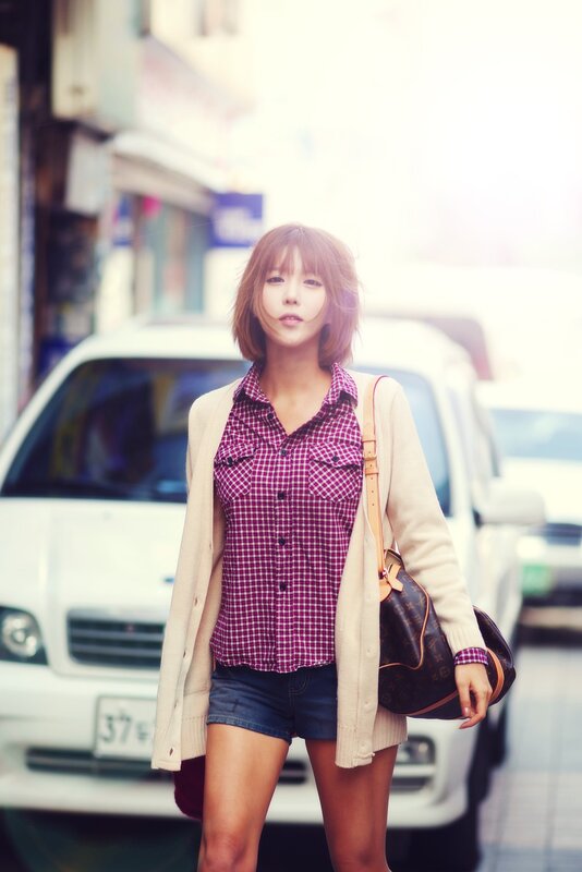 woman in plaid shirt on street