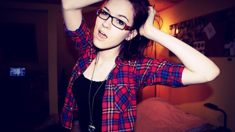 woman in plaid shirt posing