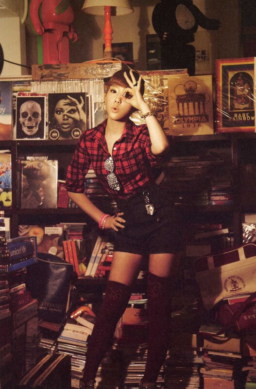 woman in plaid shirt posing