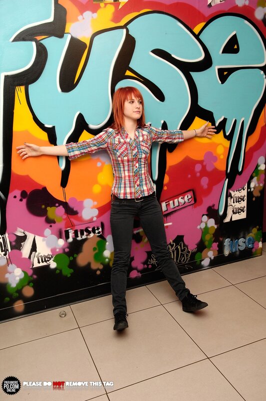 woman in plaid shirt posing