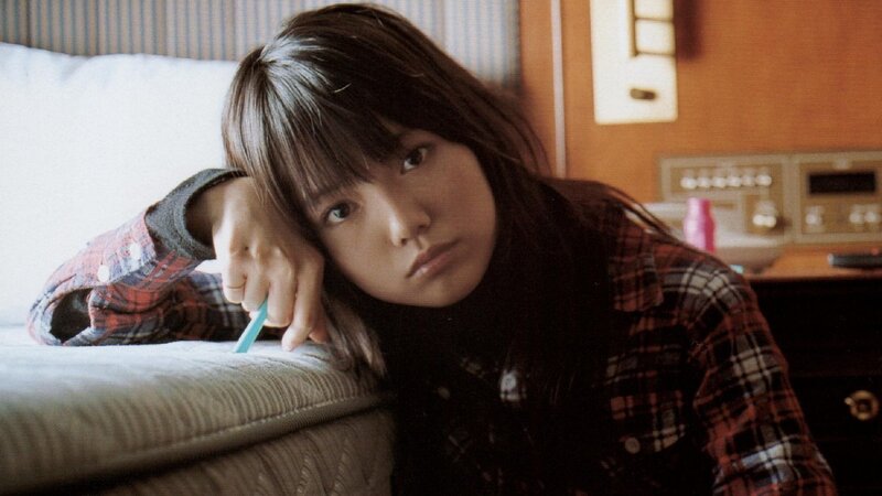 woman in plaid shirt resting