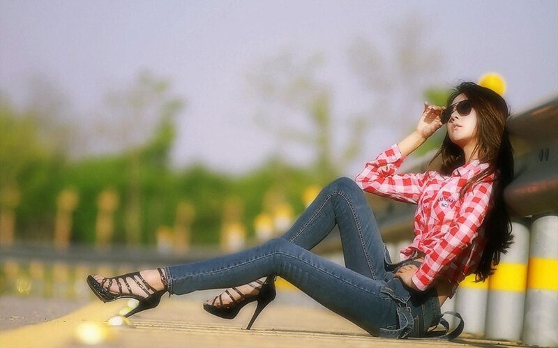woman in plaid shirt sitting