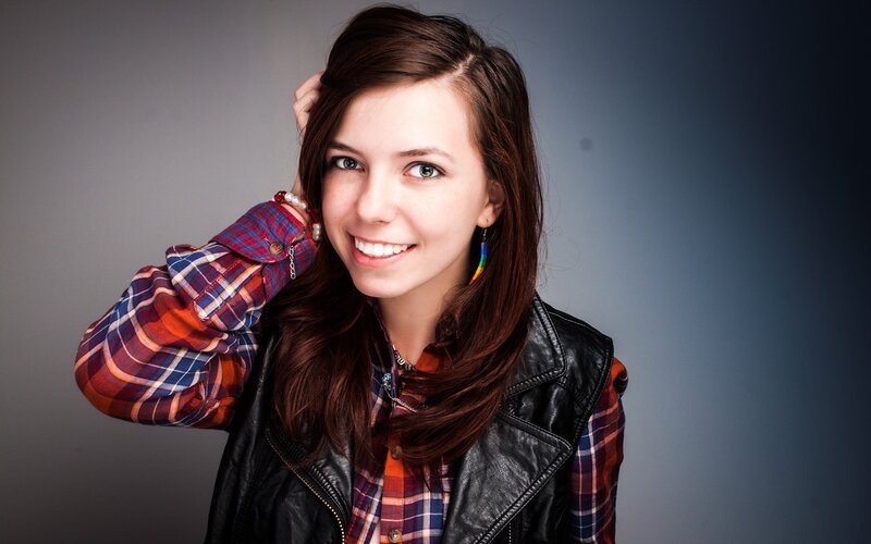 woman in plaid shirt smiling