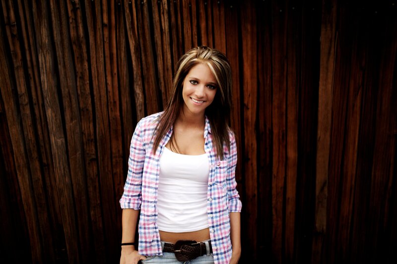woman in plaid shirt smiling