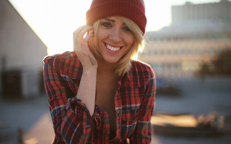 woman in plaid shirt smiling