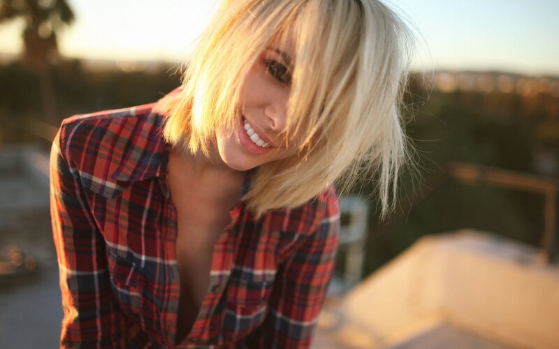 woman in plaid shirt smiling