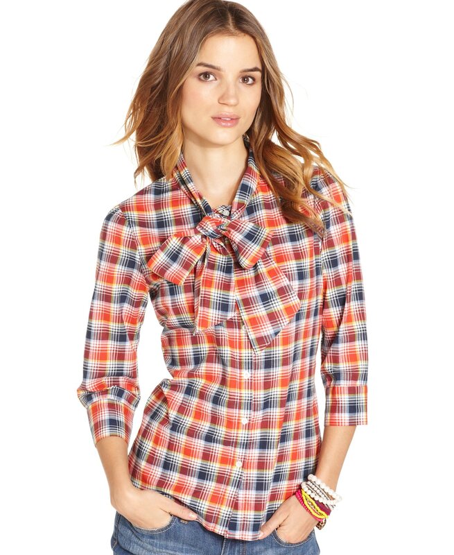woman in plaid shirt with bow