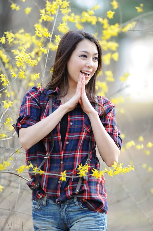 woman in plaid shirt with yellow flowers