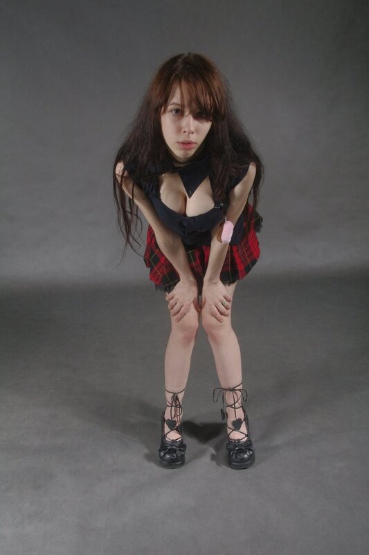 woman in plaid skirt posing