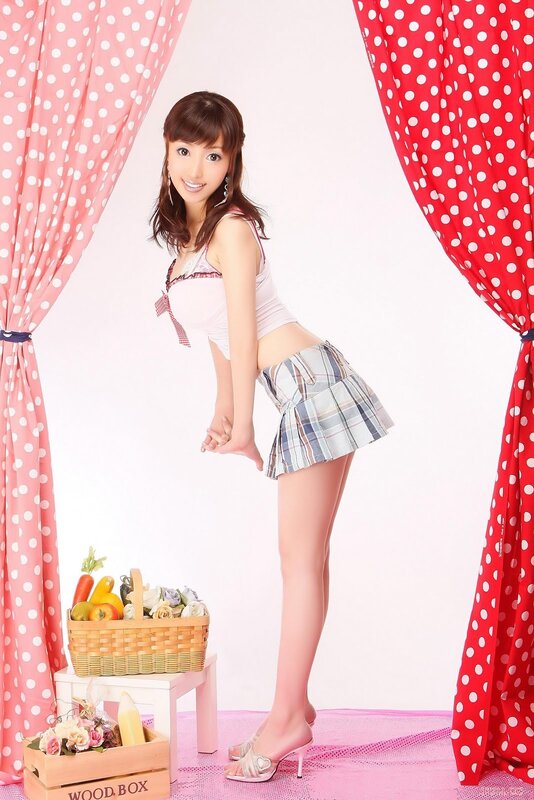 woman in plaid skirt posing