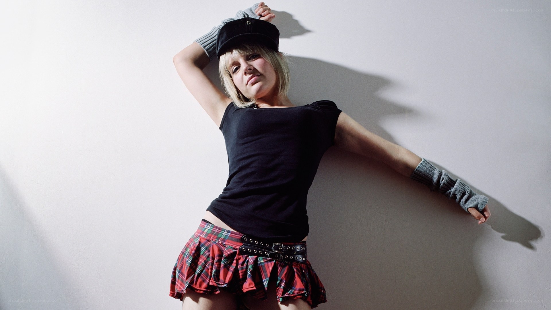 woman in plaid skirt posing