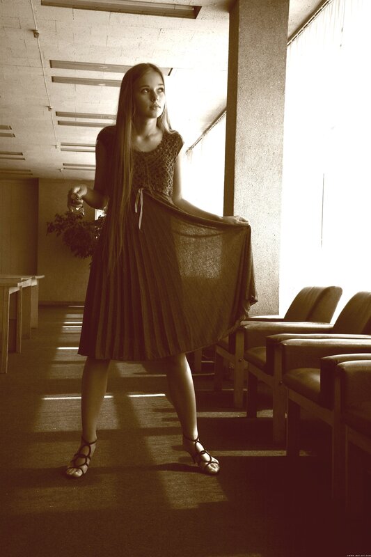 woman in pleated dress