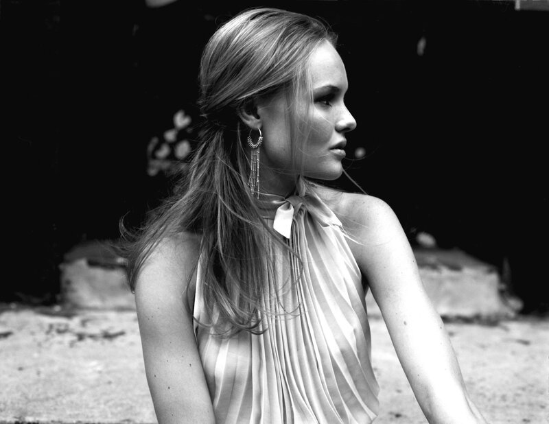 woman in pleated dress