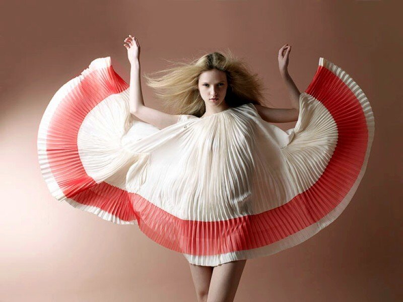 woman in pleated dress