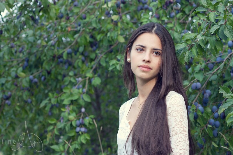 woman in plum tree orchard