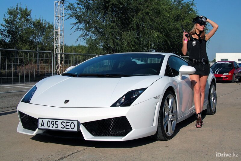 Woman in police costume with Lamborghini