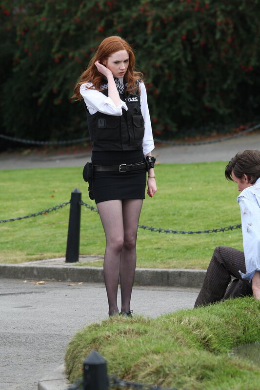 Woman in police uniform on set