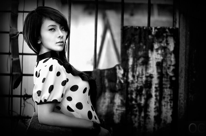 Woman in Polka-dot Dress — Black, Dramatic, Photograph, Window