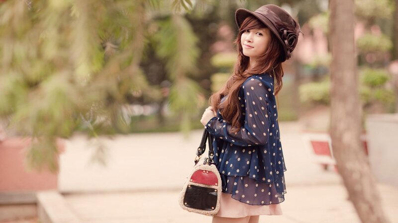 Woman in Polka-dot Dress — Blue, Serene, Afternoon
